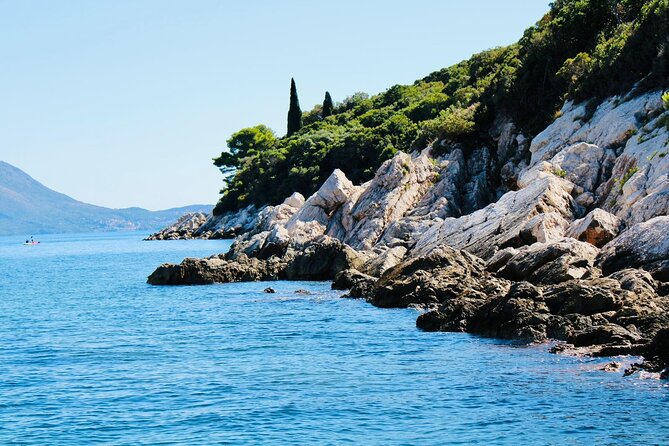 50-minute Panoramic Cruise of Dubrovnik with English Audio Guide - Passing the long shadow of Hotel Belveder