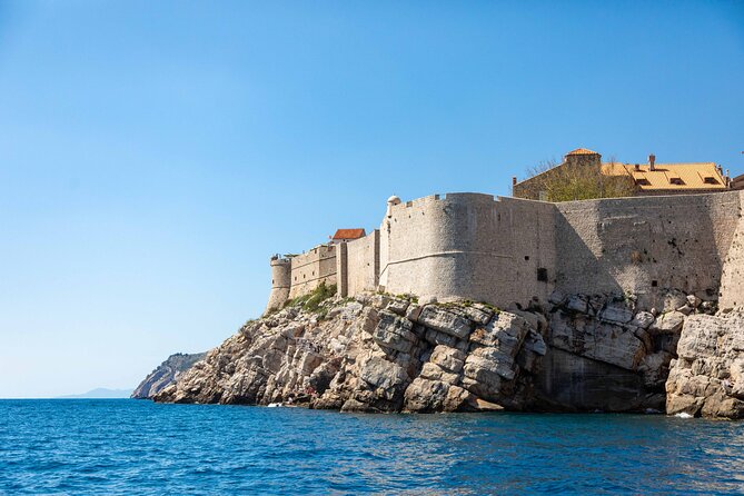 Dubrovnik 45-Minute Boat Tour Around Old Town Walls - Fort Lovrijenac from sea level: the Red Keep vibe, minus the crowds