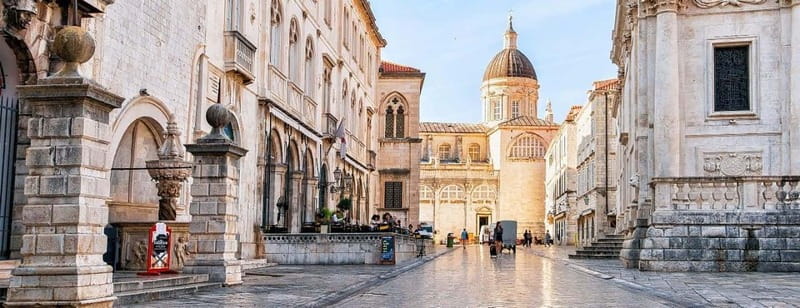 Dubrovnik: Old City Walking Tour with a FREE Polaroid Photo - Starting at Tvrdava Revelin, with an orange umbrella