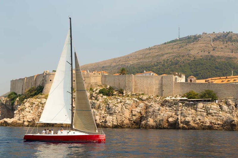 Dubrovnik: Romantic Sunset Sailing Adventure - Old Town from Sea Level: Walls, Domes, and Red Roofs in Golden Light