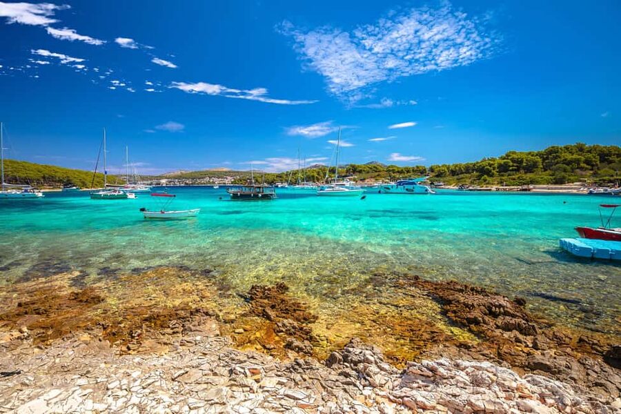 From Hvar: Blue Cave, Green Cave & 5 Islands Speedboat Tour - Pakleni Islands and Palmižana: coastline views plus a sandy beach reset