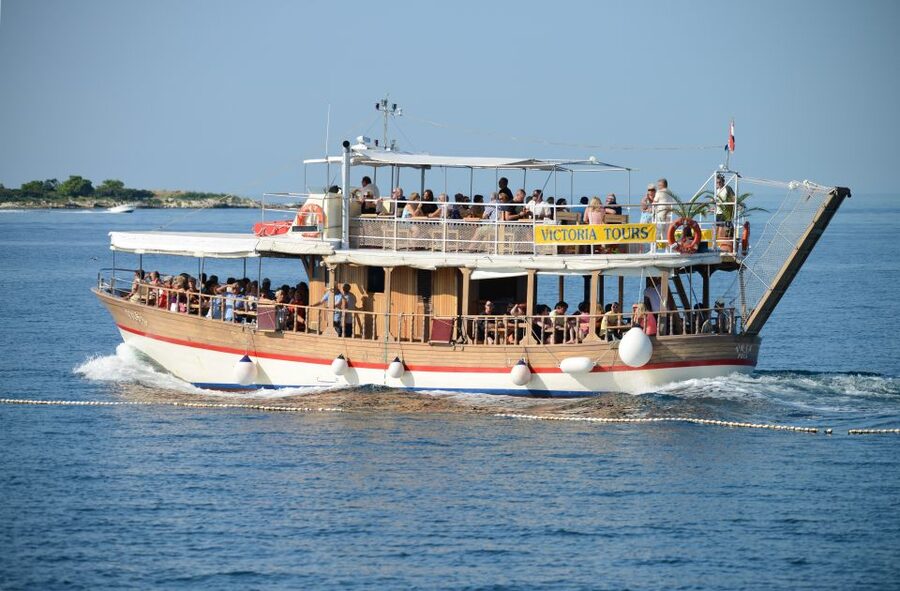 From Poreč: Lim Fjord, Rovinj, and Vrsar Boat Trip - Boarding the traditional wooden boat: calm, but not quiet