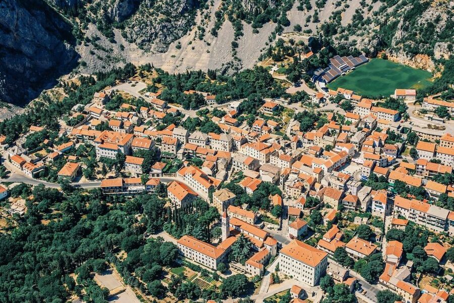 From Sinj: Flight Over Imotski, Trilj, Omiš, and Split - Omiš from above: the canyon mouth where the story opens to sea