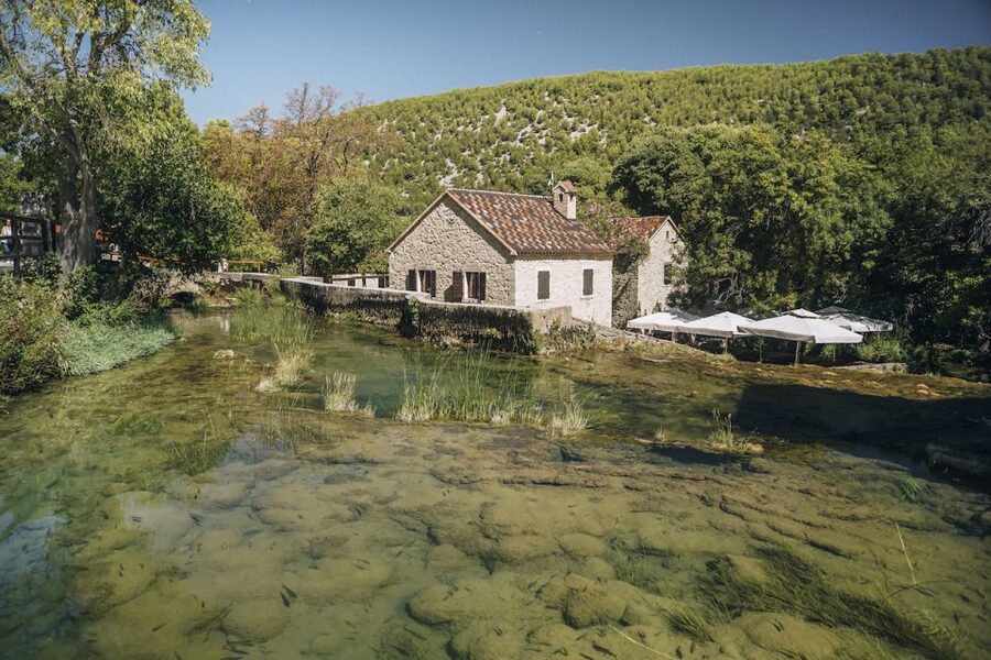 From Split: Krka Waterfalls Tour with Boat Cruise & Swimming - Panoramic boat ride toward Skradin, the calmer middle of the day