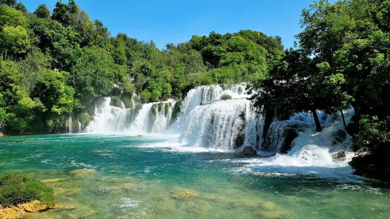 From Split: Krka Waterfalls with Riverboat Ride & swimm stop - Krka National Park guided highlights, then time to wander