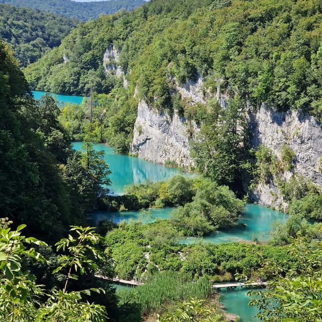 From Zadar: Plitvice Lakes Guided Tour with Boat & Train - Getting to Plitvice: pickup, bus ride, and luggage storage