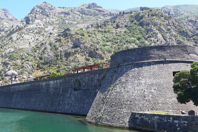 Full-Day Tour Bay of Kotor Perast Kotor and Budva small group from Dubrovnik - Kotor’s old town walls, Romanesque churches, and the practical entry fees