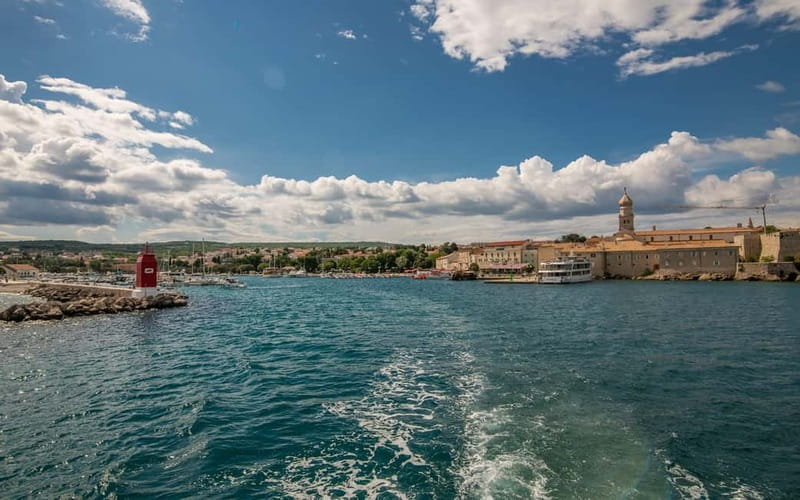 Krk: Golden Beach and Blue Cave Cruise with Welcome Drink - Sail to Plavnik: fish farm, dolphins that may show up, and why the timing matters