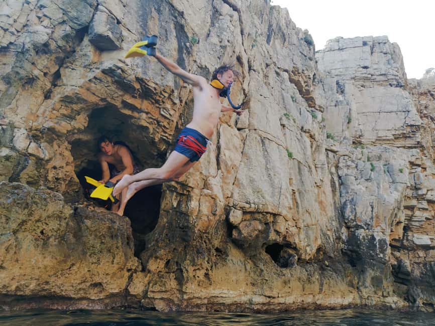 Pula Adventure: Snorkeling Boat Trip & Cliff Jumping - Onboard comfort: drinks, fruit, and photos that make it stick