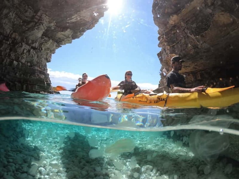 Pula: Cave Kayak, Snorkeling, Cliff Jumping All-in-one Tour - Kayaking along the rugged coast toward Kolombarica Sea Cave