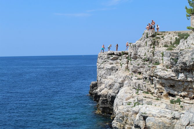 Pula Highlights Bike Adventure - Verudela Canyon: high cliffs, sunset-style views, and a second cliff jump chance