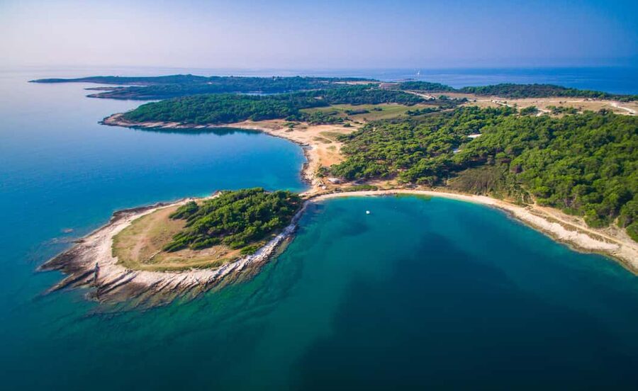 Pula: Kamenjak Bike Tour with Blue Cave and Cliffs Visit - Kolumbarice Cliffs Swimming Time in a Dramatic Setting