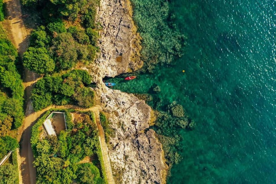 Pula: Three Island Kayak Tour with Cave Photo & Snorkeling - Fratarski Otok: beach strolling plus that first swim feeling