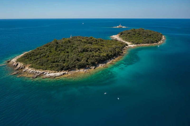 Rovinj Islands: 4-Hour Guided Kayak Tour with drinks - Kayaking the Rovinj Islands route, with two stops for snorkeling