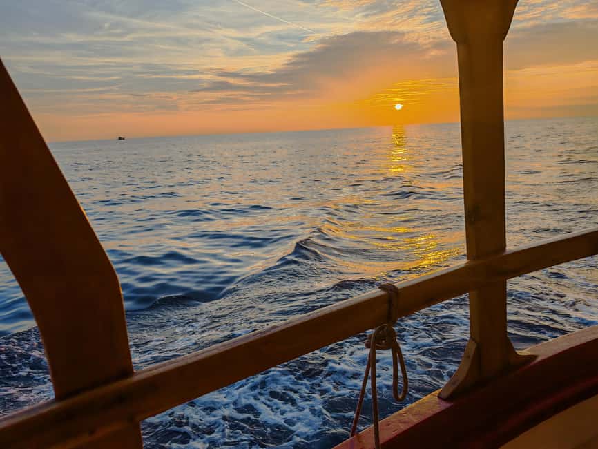 Rovinj: Sunset Lim Fjord Tour with BBQ, Swimming & Dolphins - Pirate Cave stop: cool light effects, optional vibe