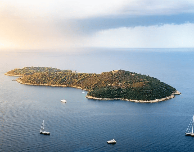Sightseeing Boat Cruise in Old Town of Dubrovnik - Banje beach coastline angle you do not get while walking