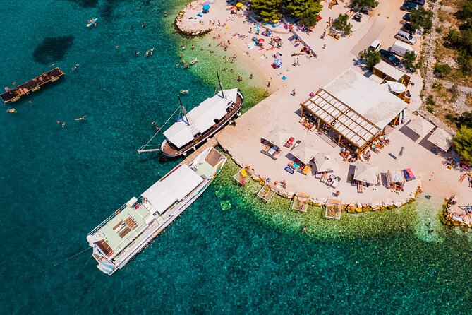 Split: Blue Lagoon, 3-Island Boat Tour & Mediterranean Lunch - Blue Lagoon (Krknjaši): Snorkeling, Shallow Water, and Slide Time