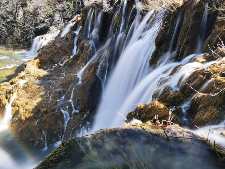 Split: Plitvice Lakes Guided Day Tour with Entry Tickets - Upper Lakes on wooden trails: birds, water sound, and calmer pacing