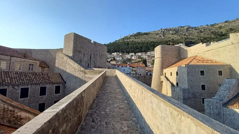 Sunset Wall Walk: 75-Minute Guided Tour & Free Exploration - Meeting at Ploče Gate, near Fort Revelin, and getting onto the walls