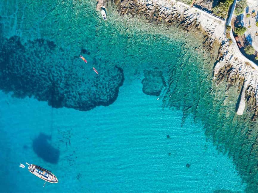 Trogir: Blue Lagoon, Maslinica, and Solinska Bay Boat Tour - The Blue Lagoon near Drvenik Veli, turquoise shallows and silver fish