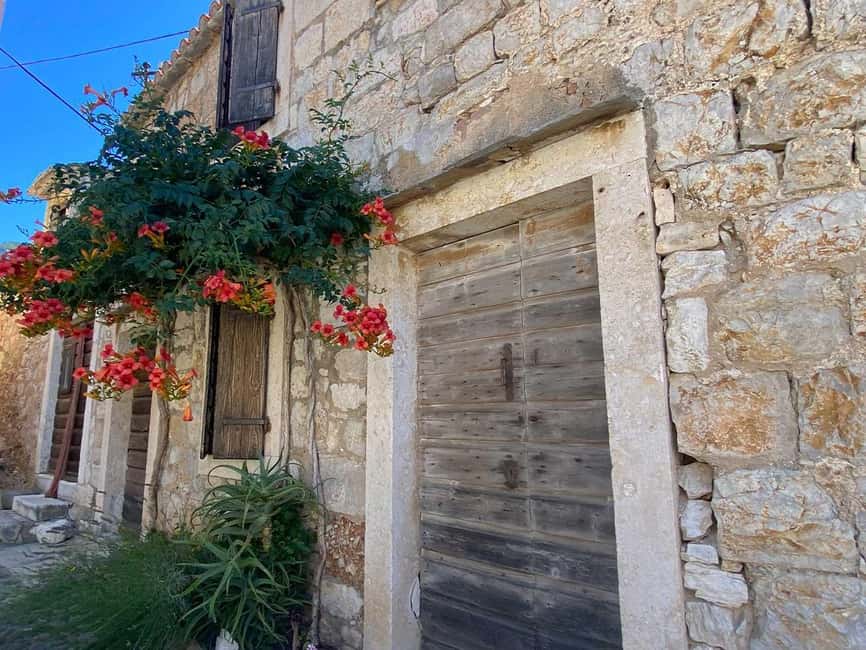 Trogir: Blue Lagoon, Maslinica, and Solinska Bay Boat Tour - Maslinica village and its castle, a slow moment inside a fast day