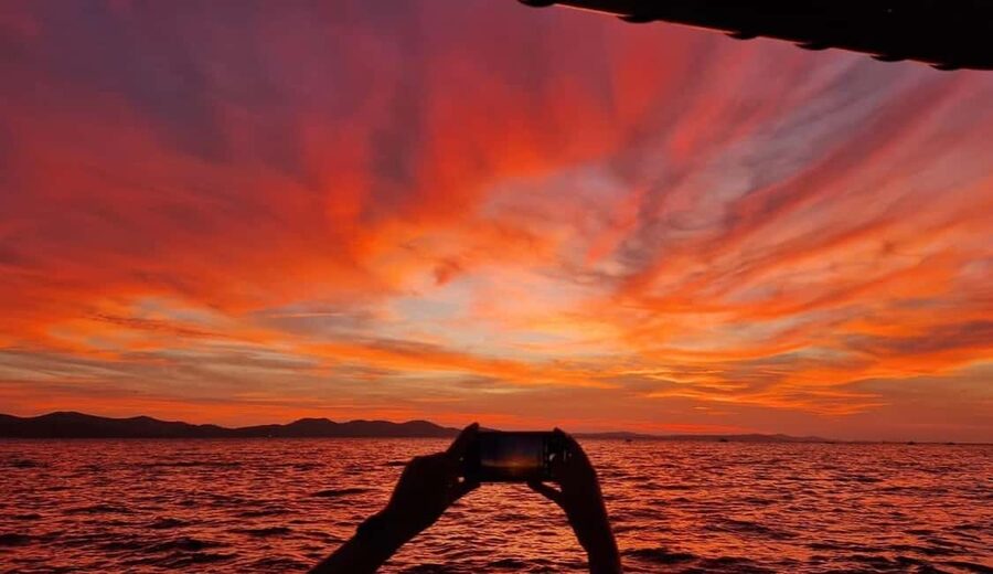 Zadar: Romantic, Luxury Sunset Boat Tour with Aperol Spritz - The Aperol Spritz toast and chill music that set the mood