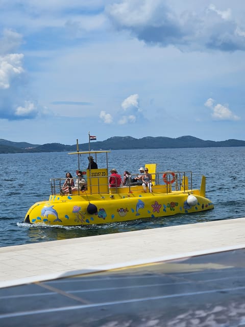 Zadar: Yellow Semi-Submarine Underwater Exploration Tour - Letting kids steer the submarine for a moment